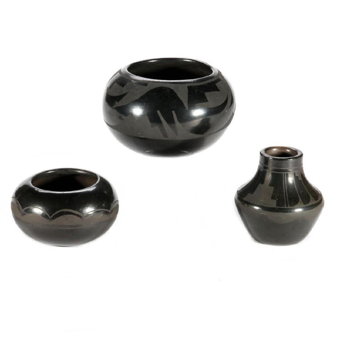 Three San Ildefonso Blackware Vessels: The largest unsigned; with a vase-form example, by Alice and Ruben Martinez; and a smaller bowl, by Lupita Martinez Diameter: 7 3/4, 4 3/4 and 5 1/2in