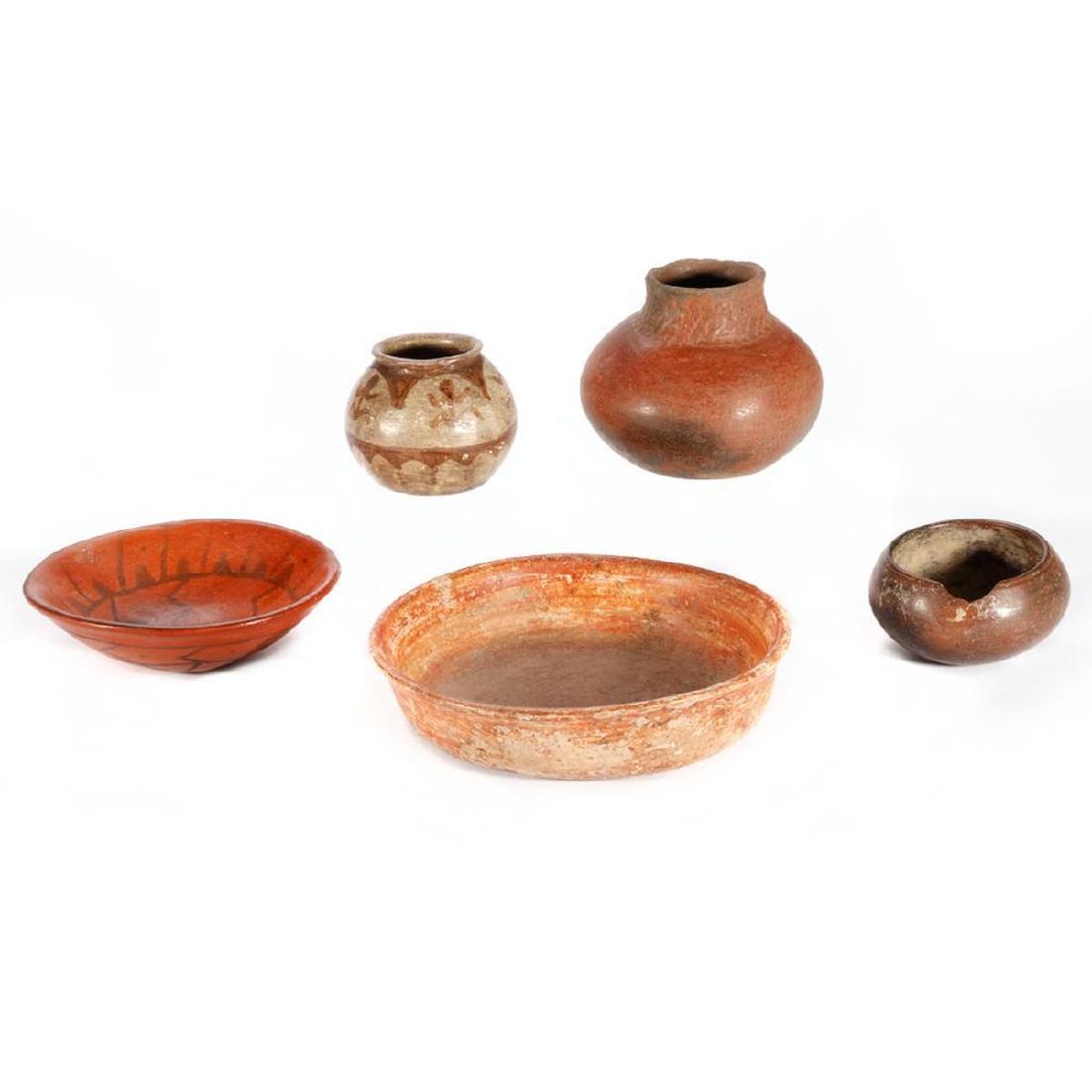Five Native American Pottery vessels: A Papago figural jar; a Maricopa plate; a Hohokam jar with corrugated neck; and two Mexican pre-Columbian examples Diameter: 4 - 8 1/2in