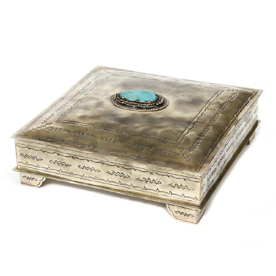 Southwest silver and turquoise box.: A Southwest silver and turquoise box stamped J. Alexander measuring 4" high x 11 1/2" square.