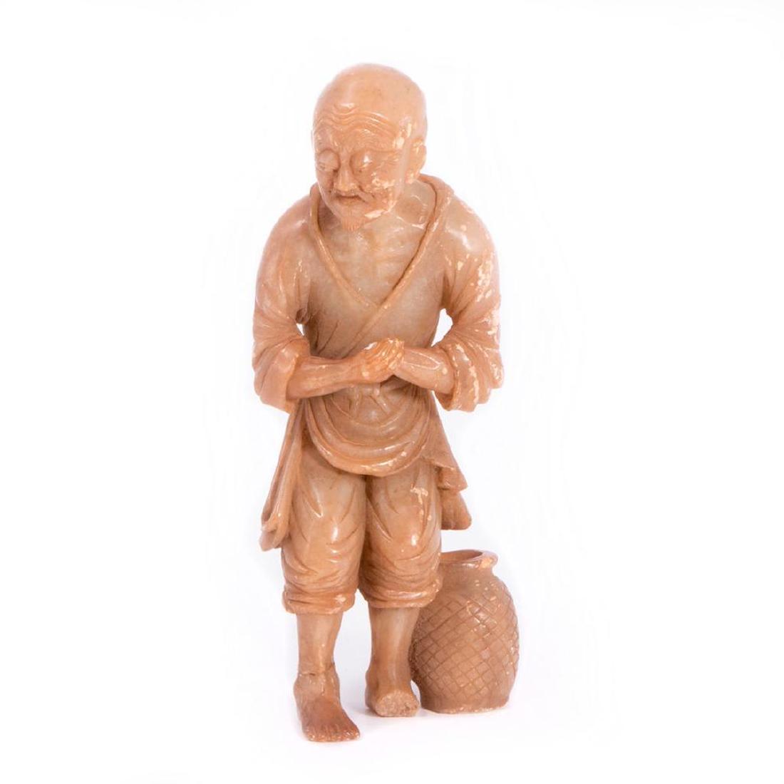 Chinese carved jade figure.: An 18th century or earlier finely carved Chinese jade figure (loss to one hand and foot), 6 3/4 inches high.