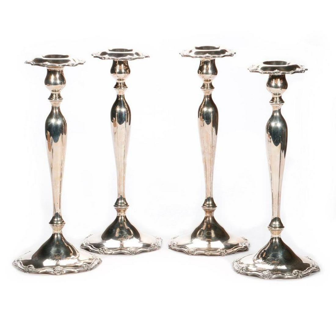 Four sterling candlesticks. (1 of 6)
