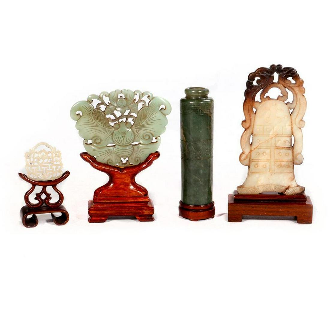 Four Chinese jade sculptures on stands. (1 of 11)