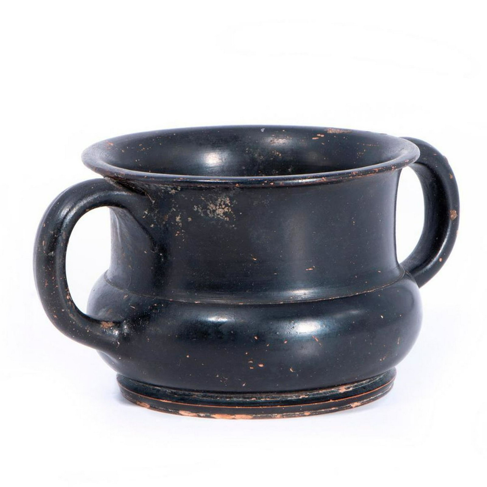 Two handled Greek bowl.: A black painted two handled Greek pottery bowl from Gela (Sicily) circa 4th century BC. Size: 3 inches high x 6 wide x 4 deep. Condition: Good. Age: 4th century BC.