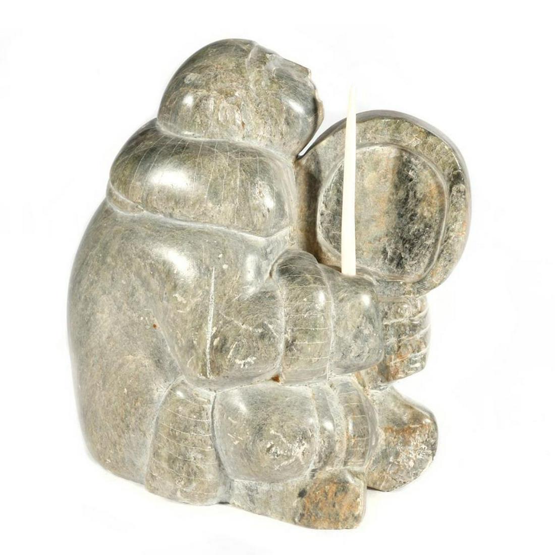 An Inuit Stone Sculpture: Melvin Olanna, "Seated Drummer" Height: 10in, Length: 9 1/2in