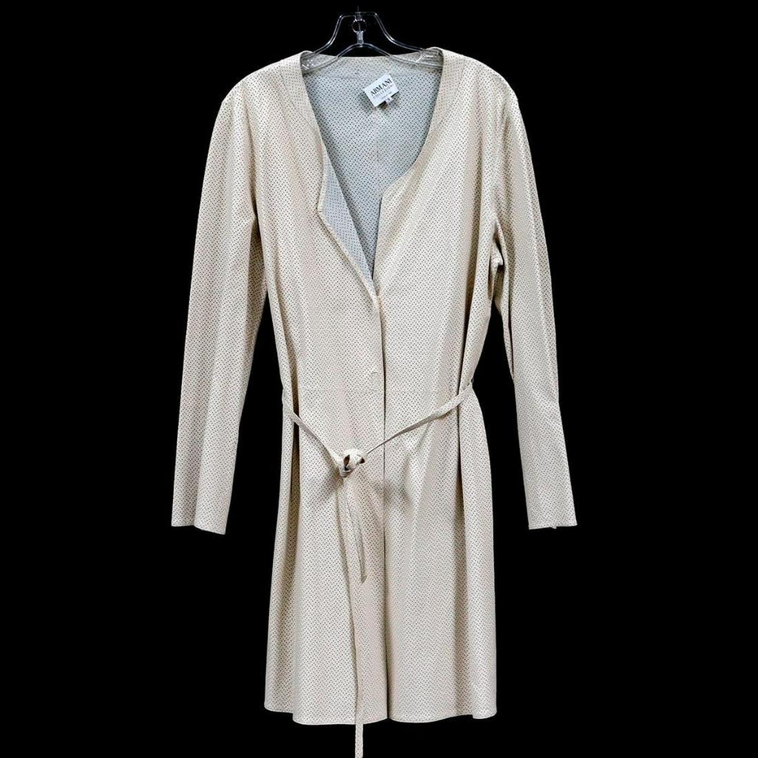 Vintage Armani Collection Leather Trench Coat: Circa 1990€™s, ivory belted perforated leather with hidden snap closures, two side pockets; overall length: 39in.; size: 14 Items are sold as is. Please inquire about condition if not otherwise st