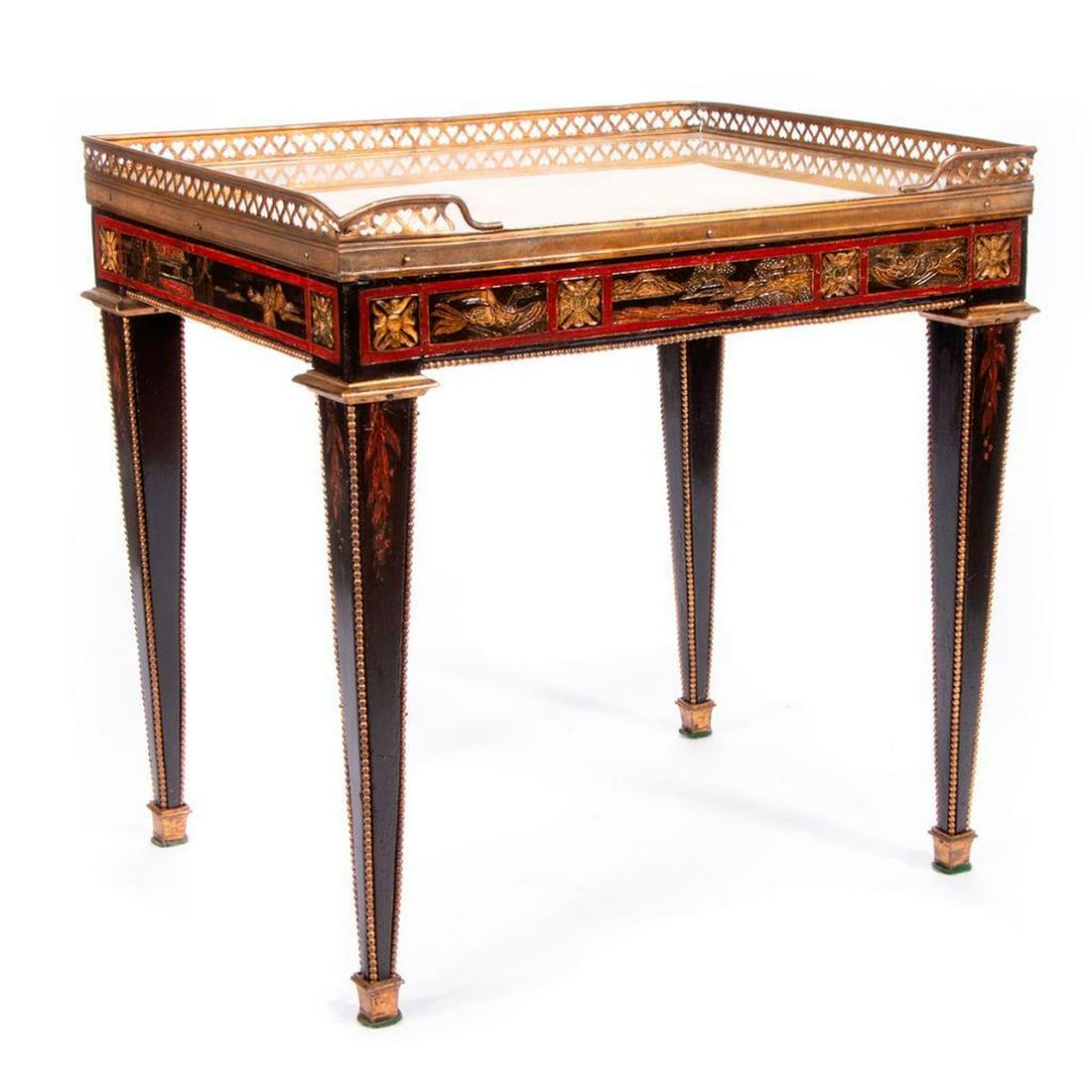 Ebonize side table: A late 19th/early20th century Continental ebonized Chinoiserie side table with a gilt wood under glass top. 18 inches high x 18 wide x 14 deep. Items are sold as is. Please inquire about condition i