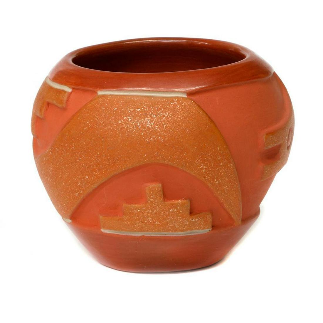 San Juan pot: San Juan pot (4 1/2" x 5 3 / 4") by Leonidas Tapia. Redware & micaceous pot with avanyu design.