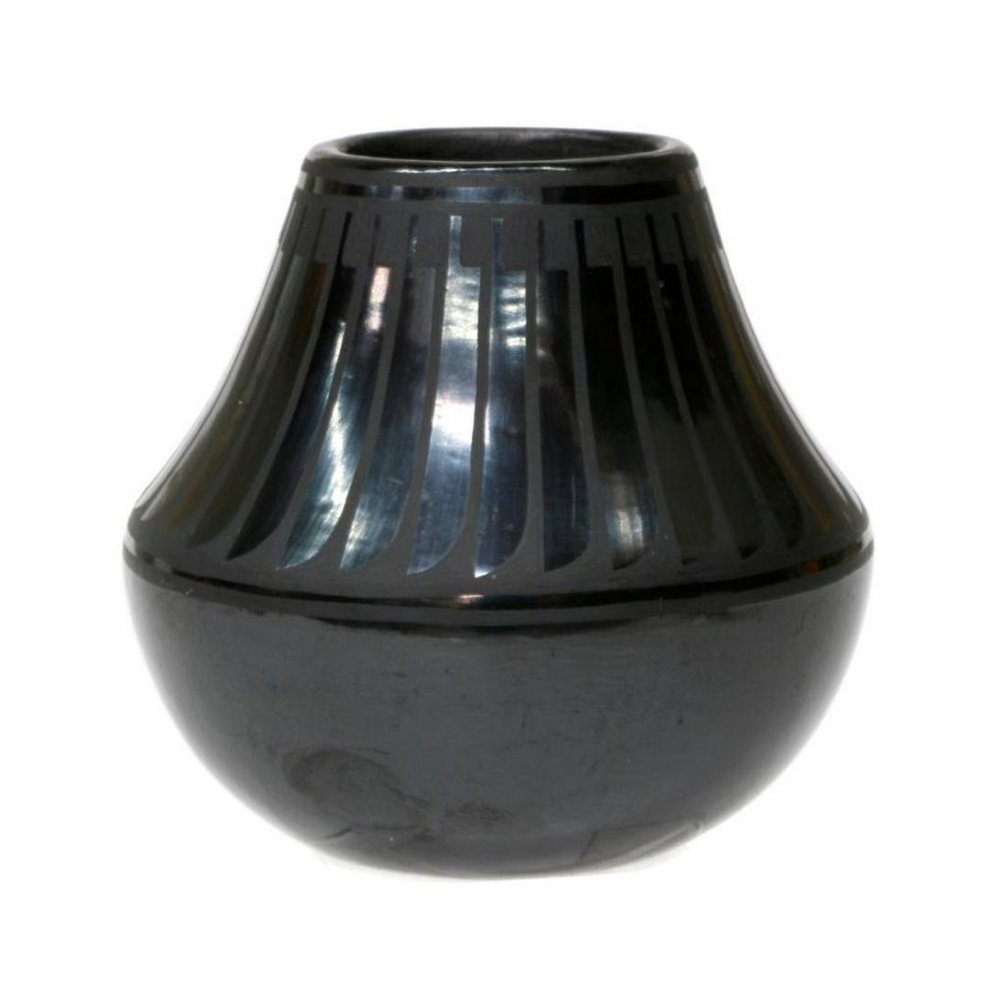 San IldefonsoÂ pot: San Ildefonso pot (5" x 5") by Blue Corn (Crucita Calabaza) 1920-1999, black on black with feather design.