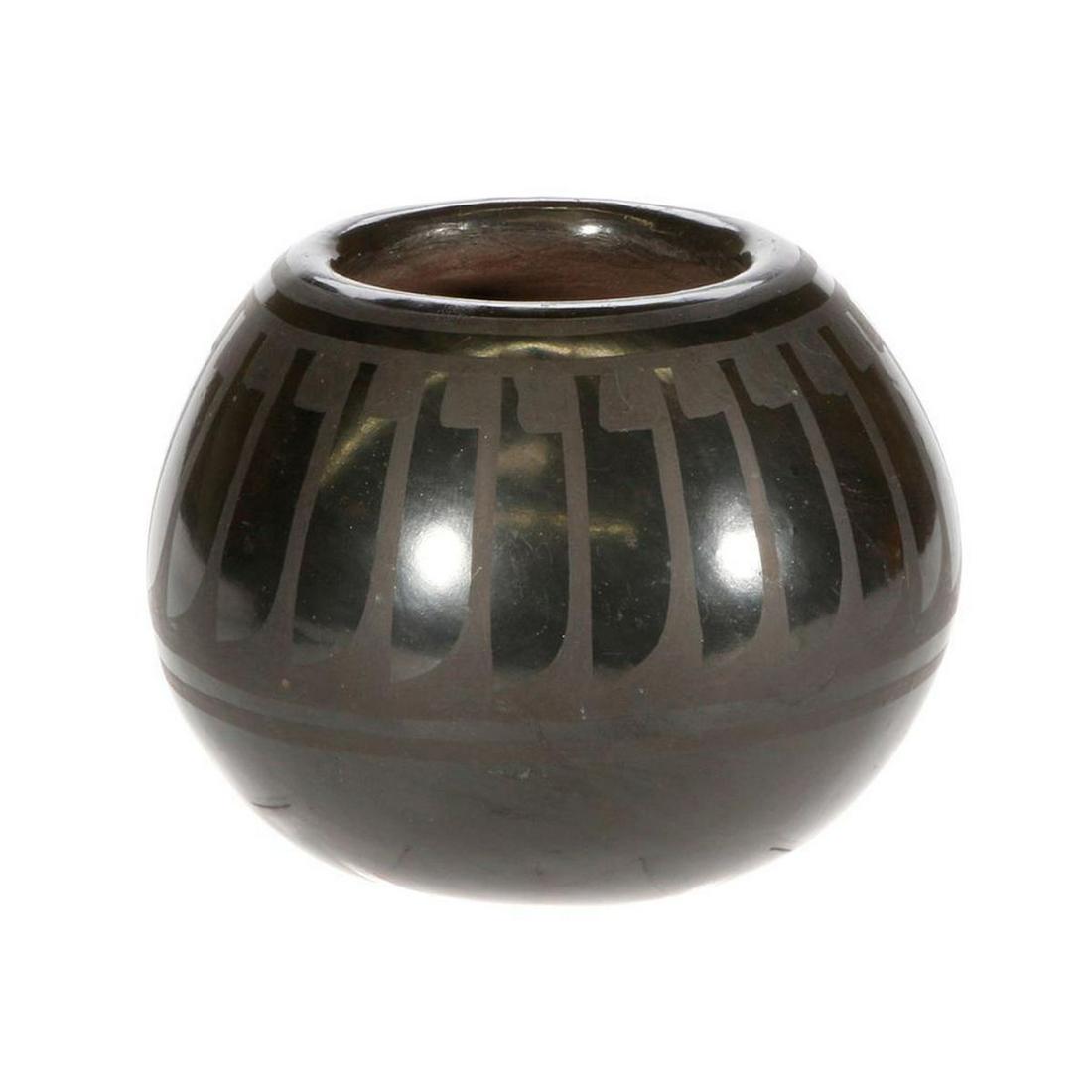 San Ildefonso bowl: San Ildefooson bowl, (35/8" x 3") by Blue Corn (Crucita Calabaza) who lived from 1920 to 1999, traditional black on black with feather design