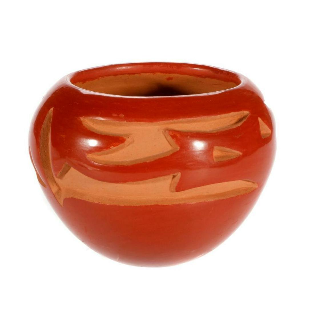 Santa Clara bowl: Santa Clara bowl, carved, polished redware w/avanyu design, (3 1/2 x 4 ½) by Sophie Cata