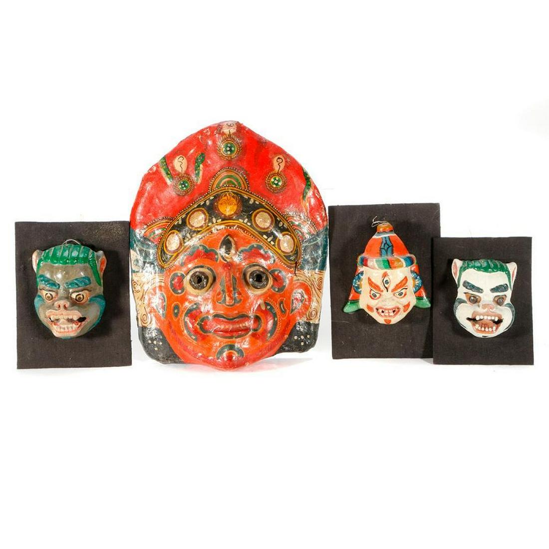 Four Nepalese masks.: Four Nepalese masks, the largest measuring 10 inches high x 8 1/4 wide. Two masks signed "Artist B.B. Lalitpur".