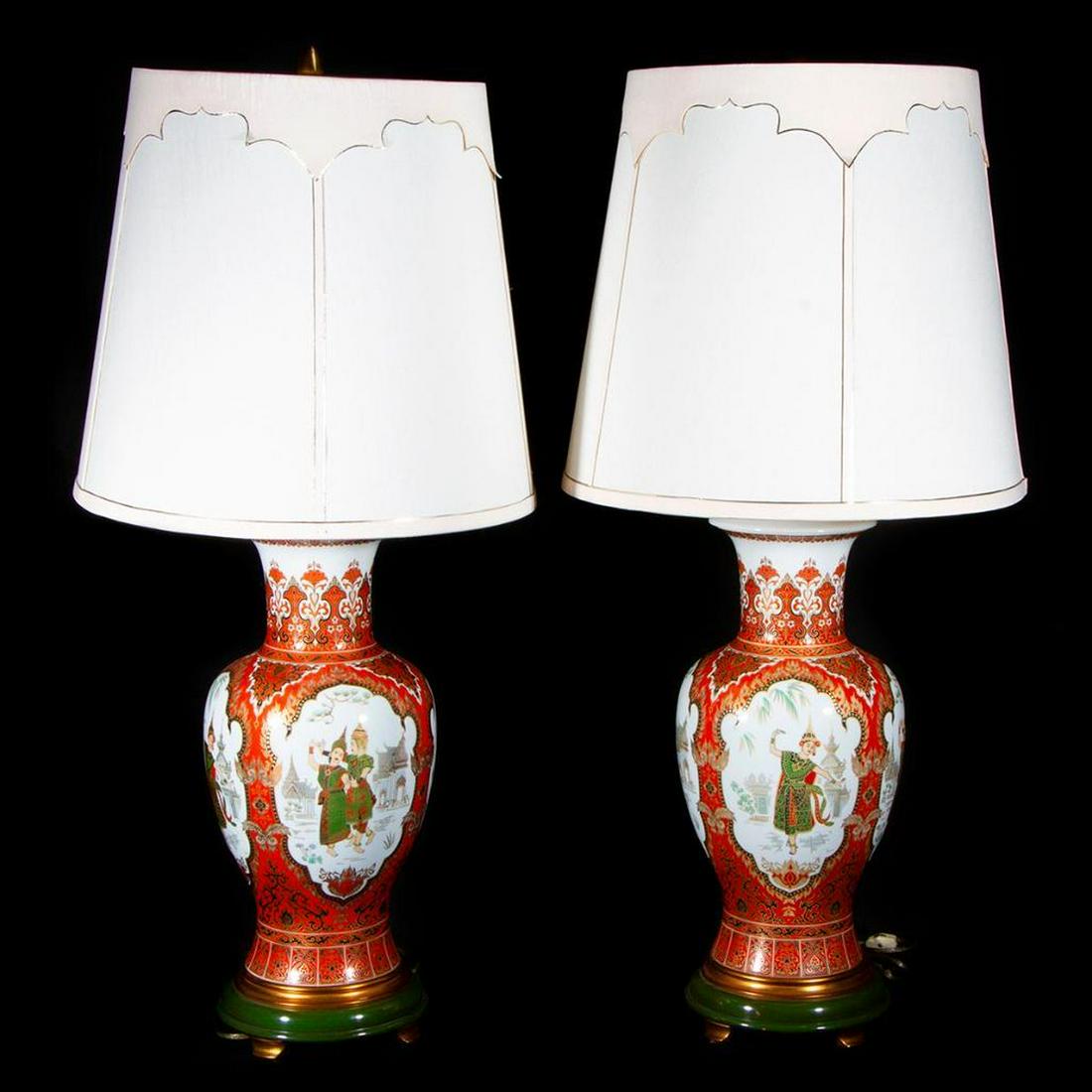 Pair of porcelain lamps.: A pair of porcelain lamps with scenes depicting Indonesian dancers each measuring 38 inches high x 8 diameter.