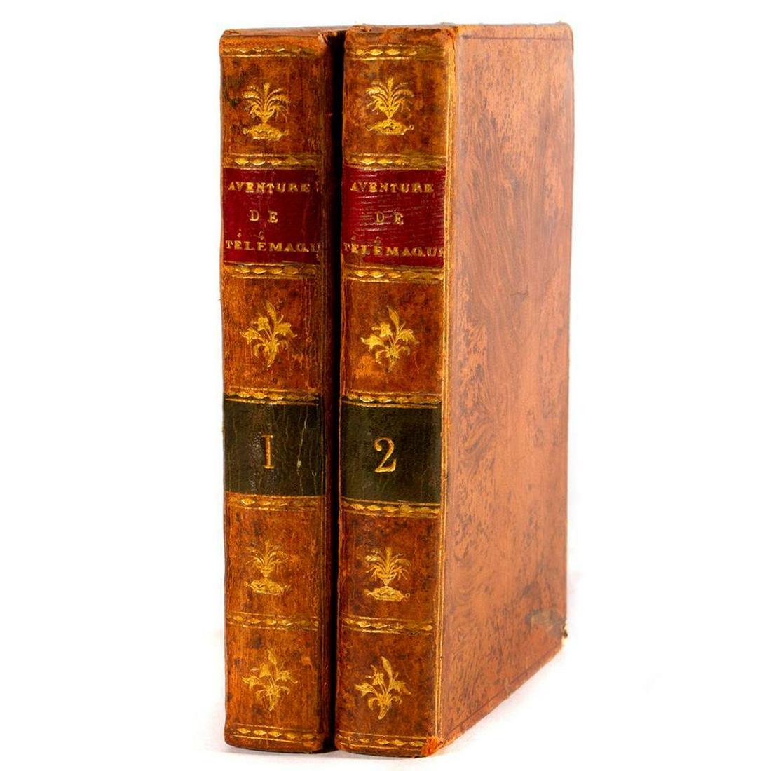 Les Aventures de Telemaque: Two Volumes (1810): Title: Les Aventures de Telemaque (1810). Description: Hardcover. Leather bound. French editions one and two. Conditon: Fair to good condition. Some chips, rubbing and wear to leather. Yellowing of
