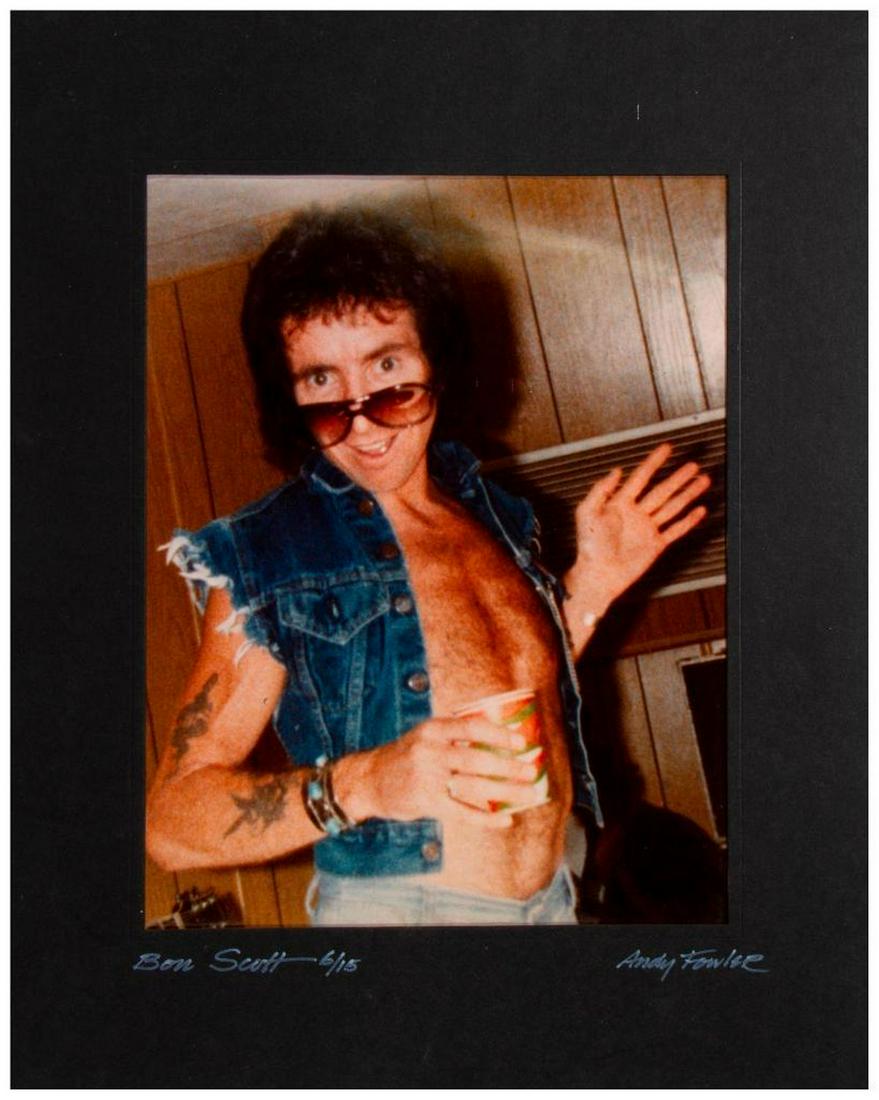 AC/DC.: A matted photo portrait of AC/DC lead vocalist Bon Scott (1946-1980). Image size: 13 1/2" high x 11 1/2". Matte size: 20" high x 16". Condition: Matte good, photo good.