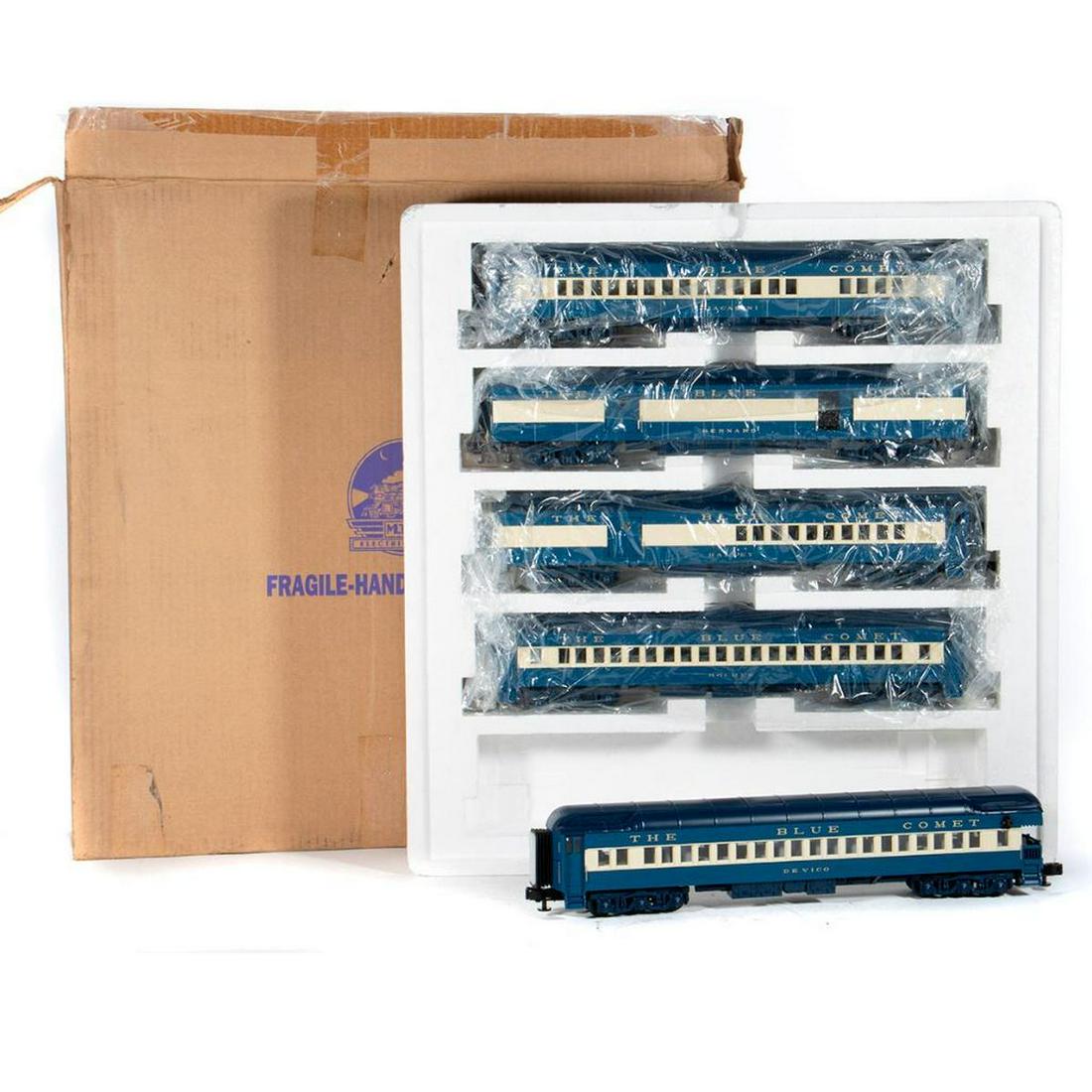 O Gauge MTH 20-4021 Jersey Central 5 Car Madison Blue: Jersey Central Blue Cream Blue Comet Madison type set with Bernard, Halley, Giacabini, Holmes, and Devico cars. Baggage, Combine, Coach, Coach and Observation. Box has shelf wear, shipping sleeve is p