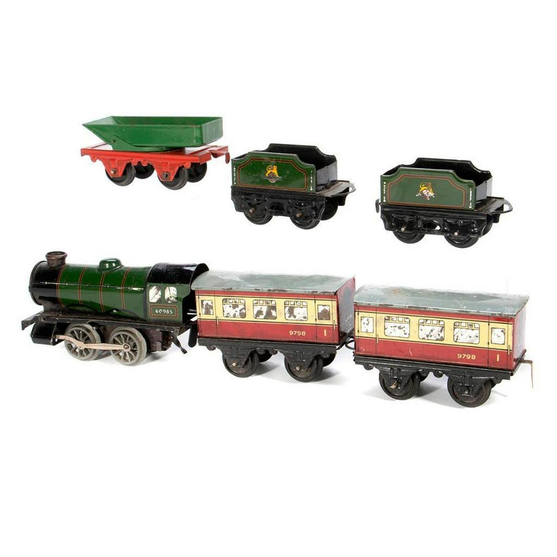 O Gauge Hornby 60985 Green wind up locomotive and: Green wind up locomotive type 20 numbered 60985 with side rods, dent in cab roof, rust spots, glue on cab roof, no key; (2) matching tenders with plastic wheels, rust spots; (2) 9798 Cream and Maroon 