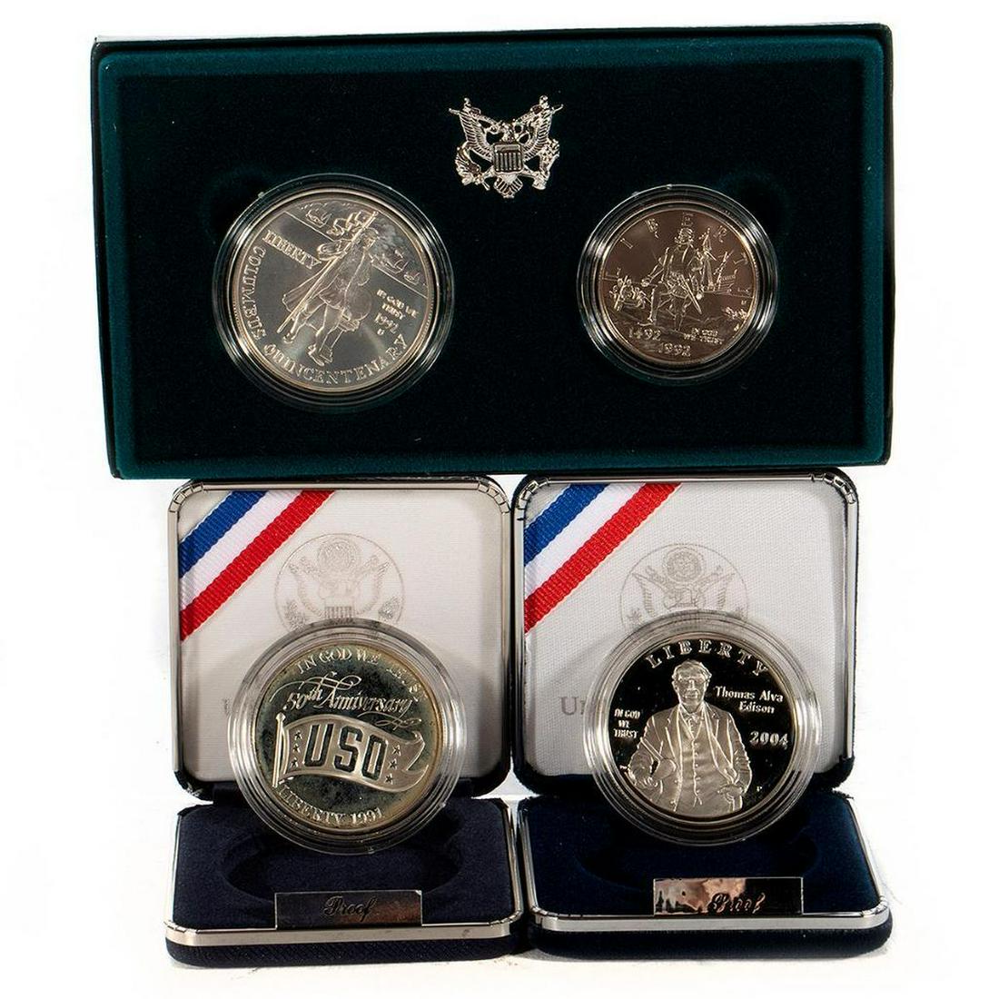 Columbus, Thomas Edison, USO Silver Dollar: (1) 1992 Columbus Quincentenaries' Two-Coin Proof Set, (1) 2004 Thomas Alva Edison-Commemorative Coin, (1) 1991 USO Silver Dollar.