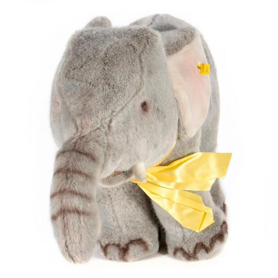 Large Vintage Steiff Elephant: Larger scale vintage Steiff elephant with original tag and button. Largest measurement at 19 inches.