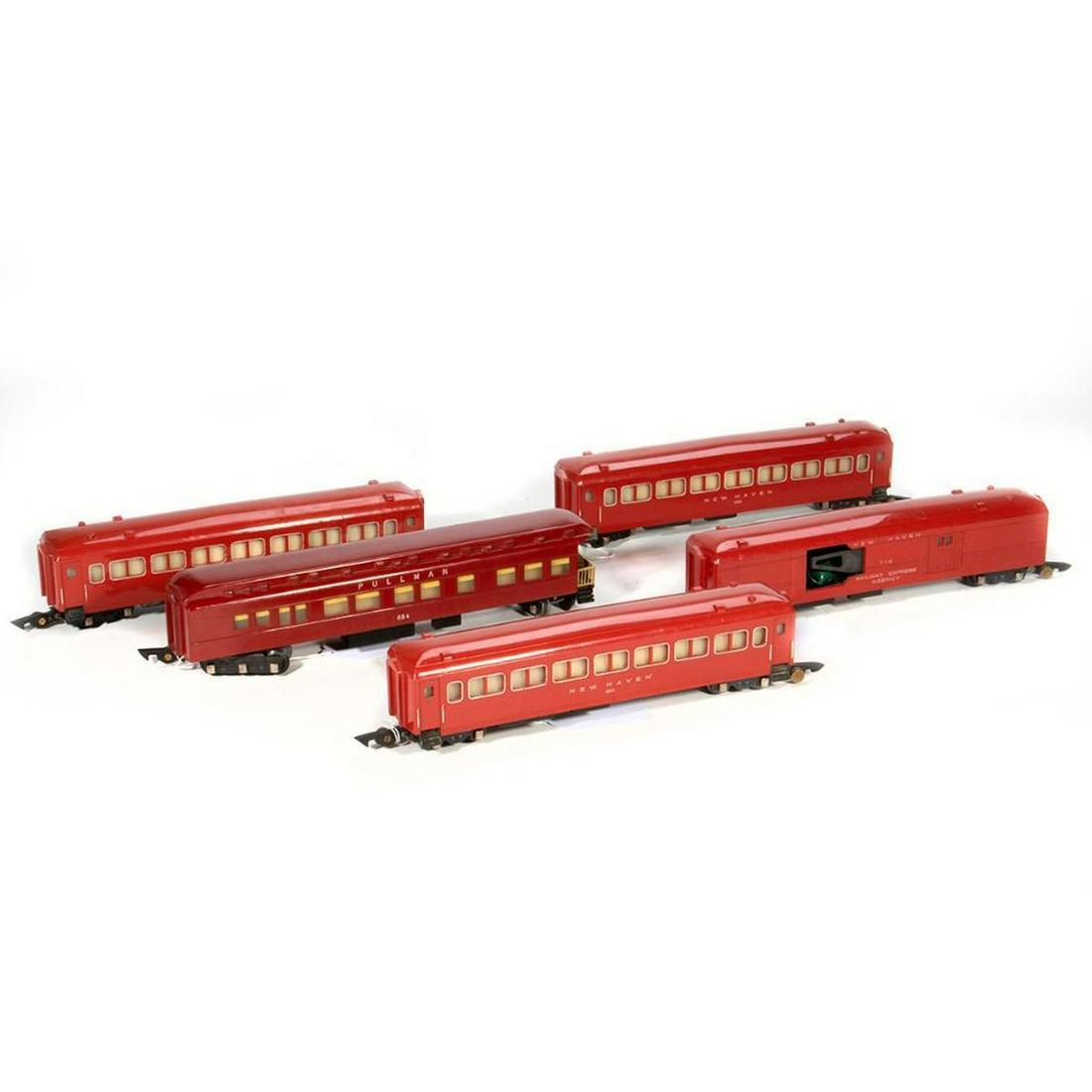 Gilbert S Gauge (5) Piece 1948 Link Coupler Passenger: 718 Red New Haven REA Mail Pick Up Car with broken activator clip; (3) 650 Red New Haven Lighted Coach; 654 Red Pullman Observation with chipped corner over platform, no boxes