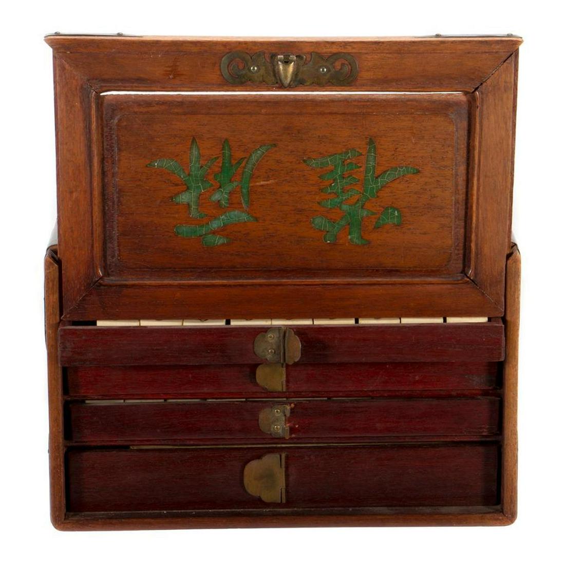 Vintage Cased Mahjong Set: The brass mounted case sliding open to five drawers containing a complete set of 152 bone and bamboo tiles and counters. Case: 6in. h. 10in. w. Condition: Minor wear to box as expected for age and use