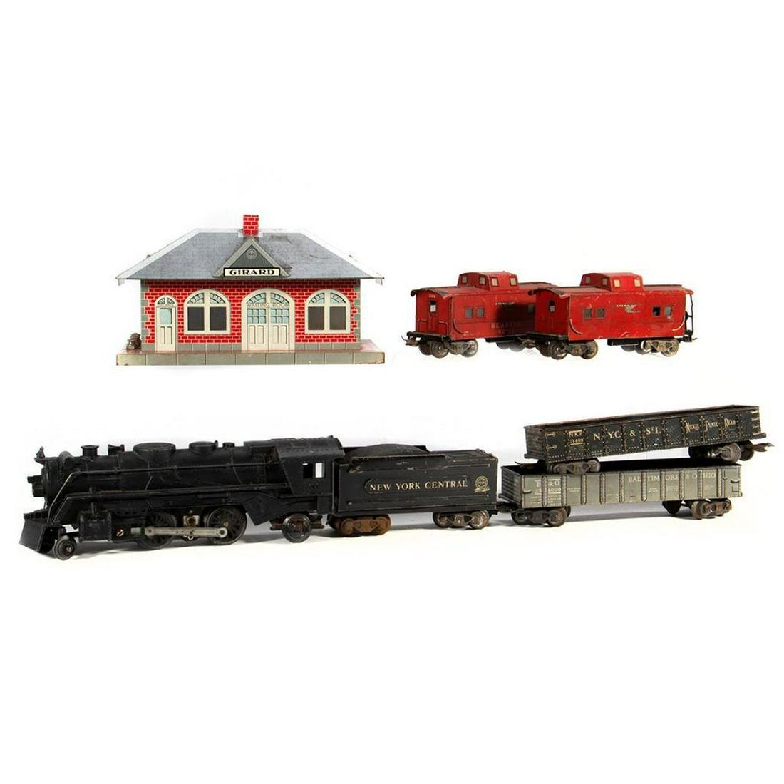 Marx train cars and Girard whistling station: Marx 666 2-4-2 locomotive, NYC scale tender, B&O 254000 scale Gondola, NKP 71499 scale Gondola, (2) 92812 Reading scale Caboose. Girard whistling station 666 smoking 2-4-2 die cast locomotive. scuffs 