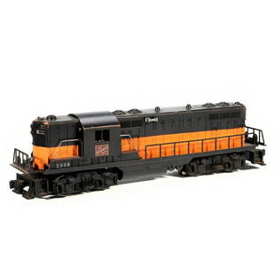 Lionel 2338 Milwaukee Road GP7: 2338 Black and Orange Milwaukee Road GP7. Hand rails and horn - intact. Corrosion around battery compartment. One body mount screw is jammed and not quite seated. Black paint is worn around edges