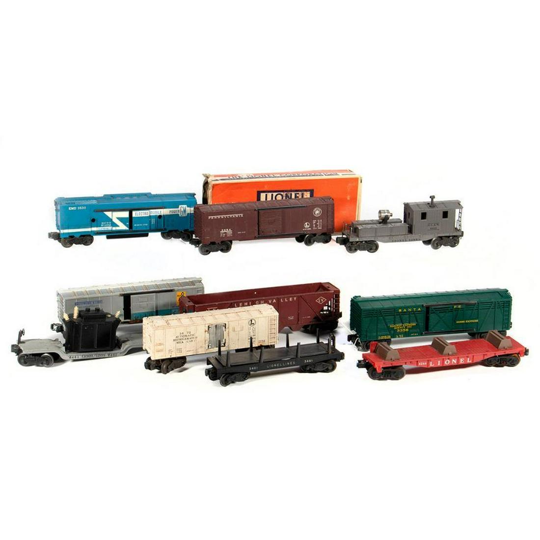 Lionel train cars: Lionel 3484 Pennsylvania Box Car, 6264 Lionel Fork Lift Car, 3356 Santa Fe Horse Express, 6436-25 Lehigh Valley Hopper with damage, 3530 GM Electro Mobile Power Car, 6461 Transformer Depressed Center 