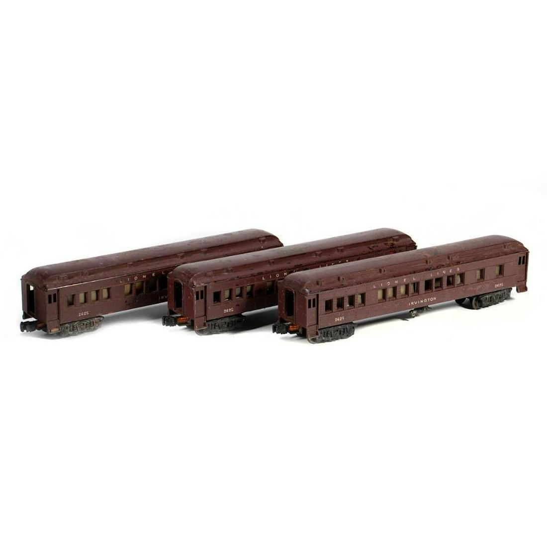 Three Lionel 2625 Irvington Heavyweights: Lionel 2625 Irvington Heavyweight. Paint is a disaster. Doors, steps, brake cylinder, rucks and couplers present. Many windows pushed in. 2625 Irvington Heavyweight. Paint is a disaster. Doors, trucks