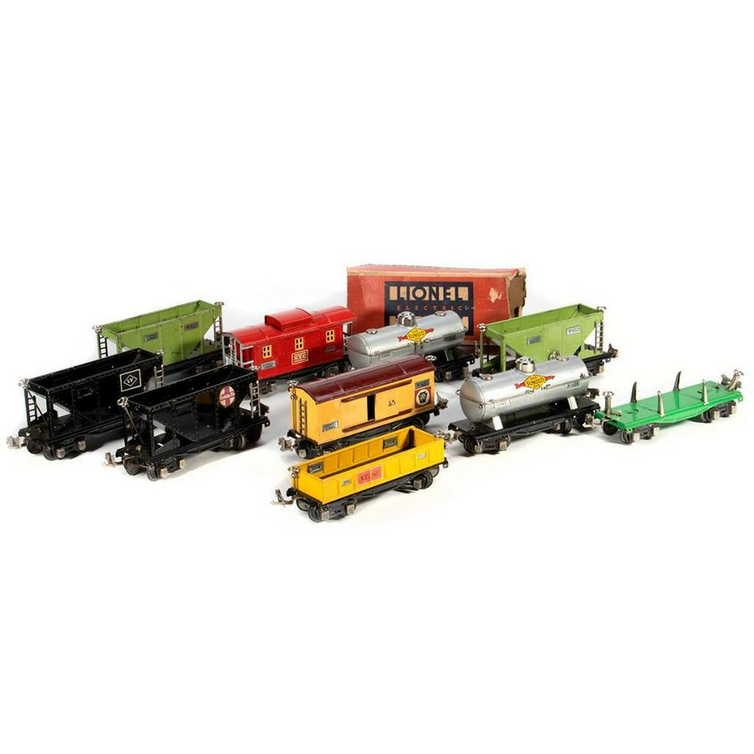 Lionel train cars: Lionel 654 Sunoco Tank Car, 657 Caboose, 651 Flat Car, 654 Sunoco Tank Car, 653 Hopper Car, 655 Box Car, 652 Gondola, 653 Hopper Car, 653 Hopper Car, 653 Hopper Car Lionel 657 Red Caboose. Cupola, end