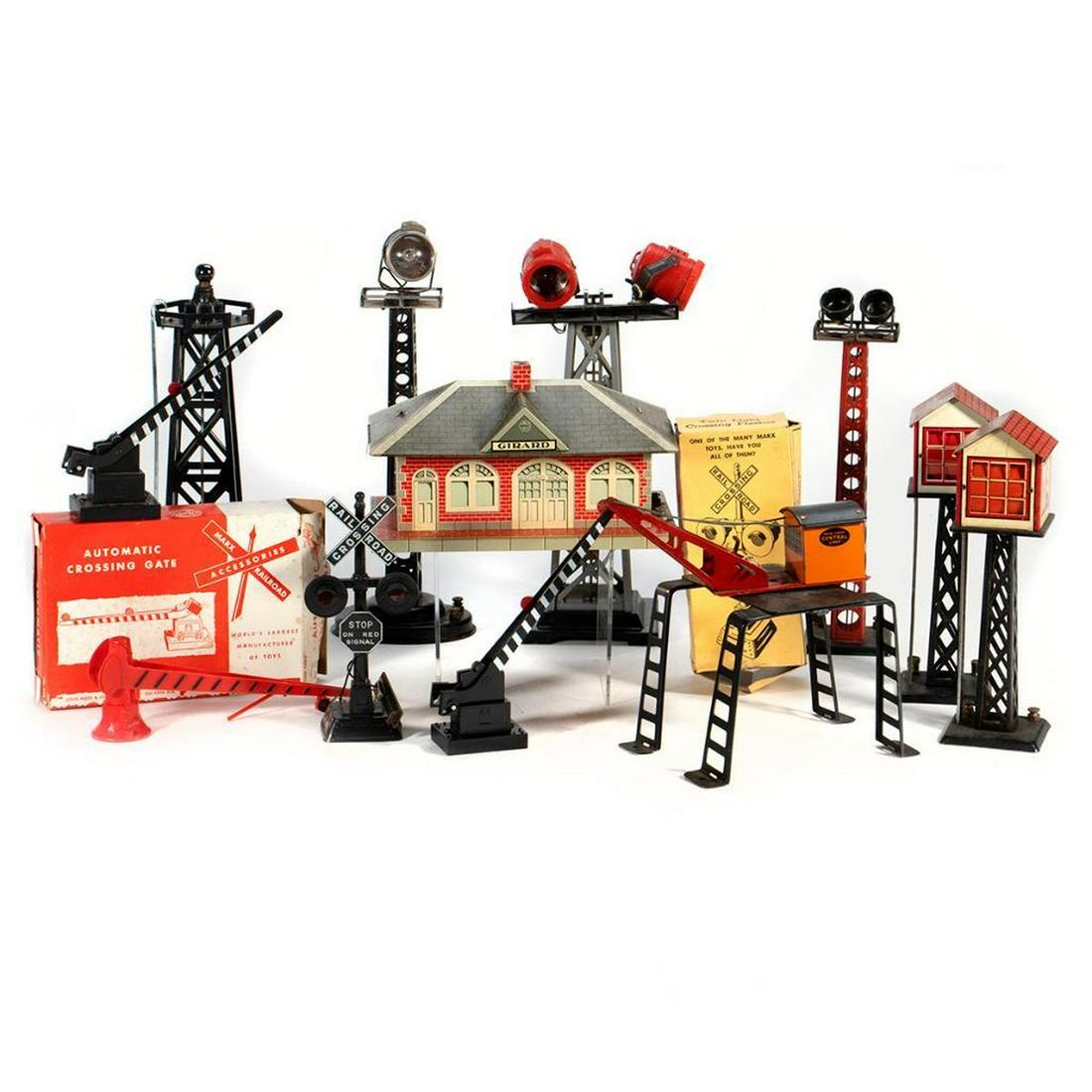 Marx train accessories: Marx 421 Twin Light Crossing Flasher, 0446 Revolving Beacon, 065 Water Tower, 428 Automatic Crossing Gate, 428 Automatic Crossing Gate, Girard Whistling Station, NYC Gantry Crane, Dual Floodlight Towe