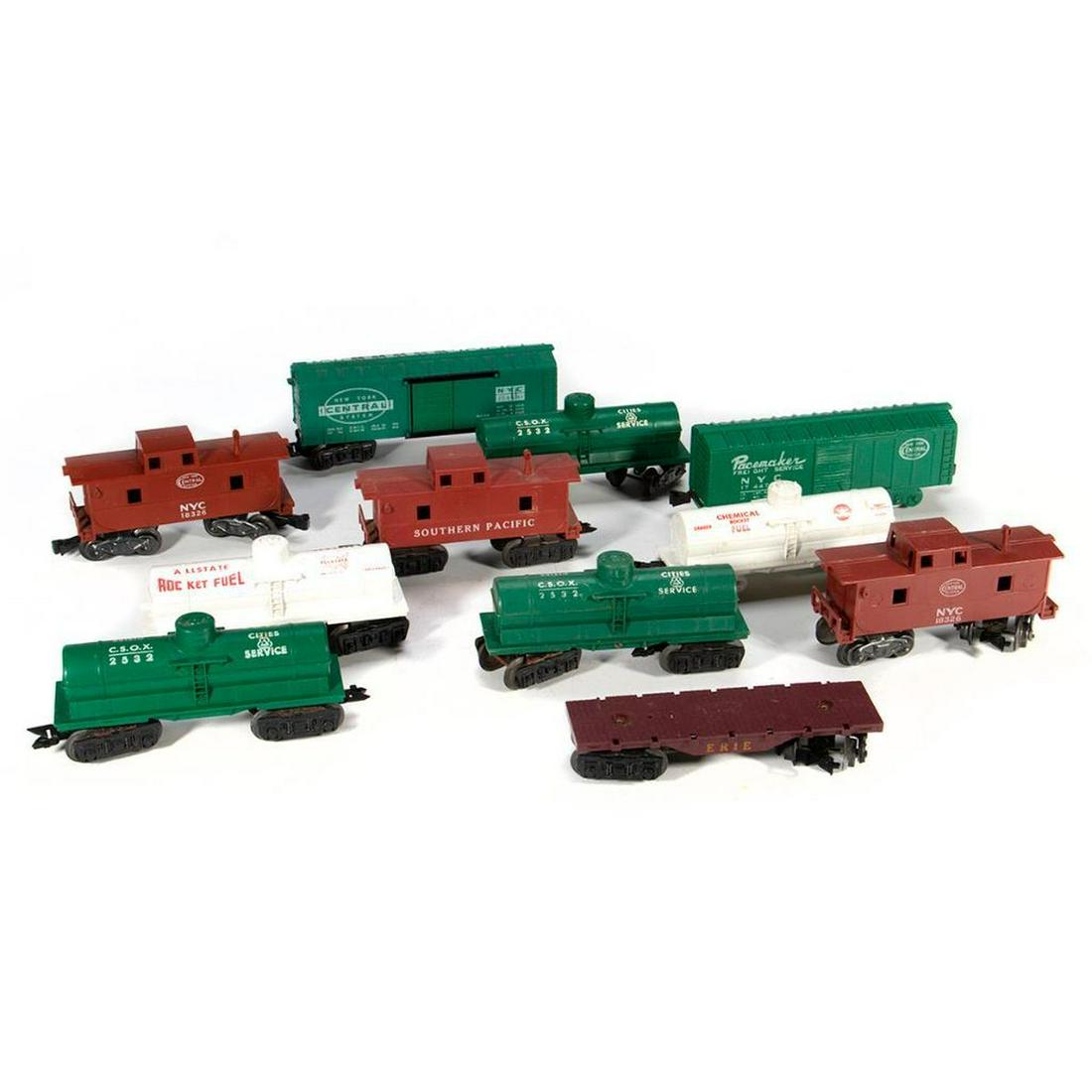 Marx train cars: Marx Erie 8 Wheel Flat Car, 174479 NYC 4 wheel box car, 18326 NYC 8 wheel caboose, 17693 NYC 8 wheel box car, 2532 Cities Service 8 Wheel tank car, 2532 Cities Service 8 Wheel tank car, X246 Chemical 