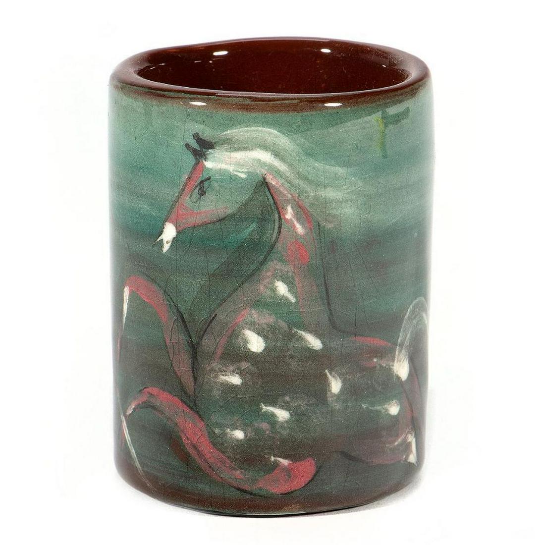 Polia Pillin Mid Century Cup: Polia Pillin (1909-1992) Polish-American The cylindrical cup decorated with stylized horses. Signed under glaze on base. 3in. (8cm) h. Condition: Small firing blemish under rim, otherwise good.