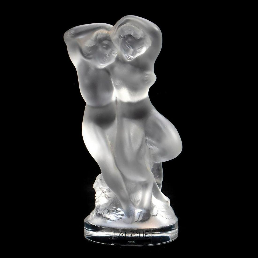 Lalique Glass Figure of Bacchantes: The frosted glass figure of the couple above fruited vines. Lalique France etched on base. 5 1/2in. (14cm) Condition: Very minor chips to reverse of both figures.