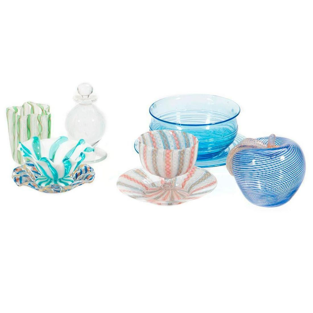 A Collection of Murano Glass: The collection includes a stoppered perfume bottle, a small goblet, and bowls and saucers, an apple form paperweight, nine pieces. Greatest height: 4 1/2in. (11cm); greatest diameter 6in. (15cm) Condi