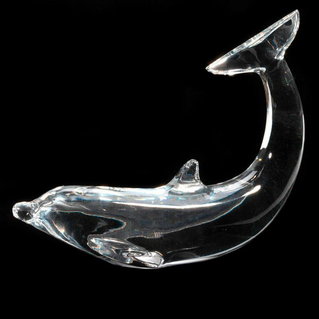 Baccarat Glass Figure: The clear glass figure of a dolphin. 4in. (10cm) l. Condition: Very good.