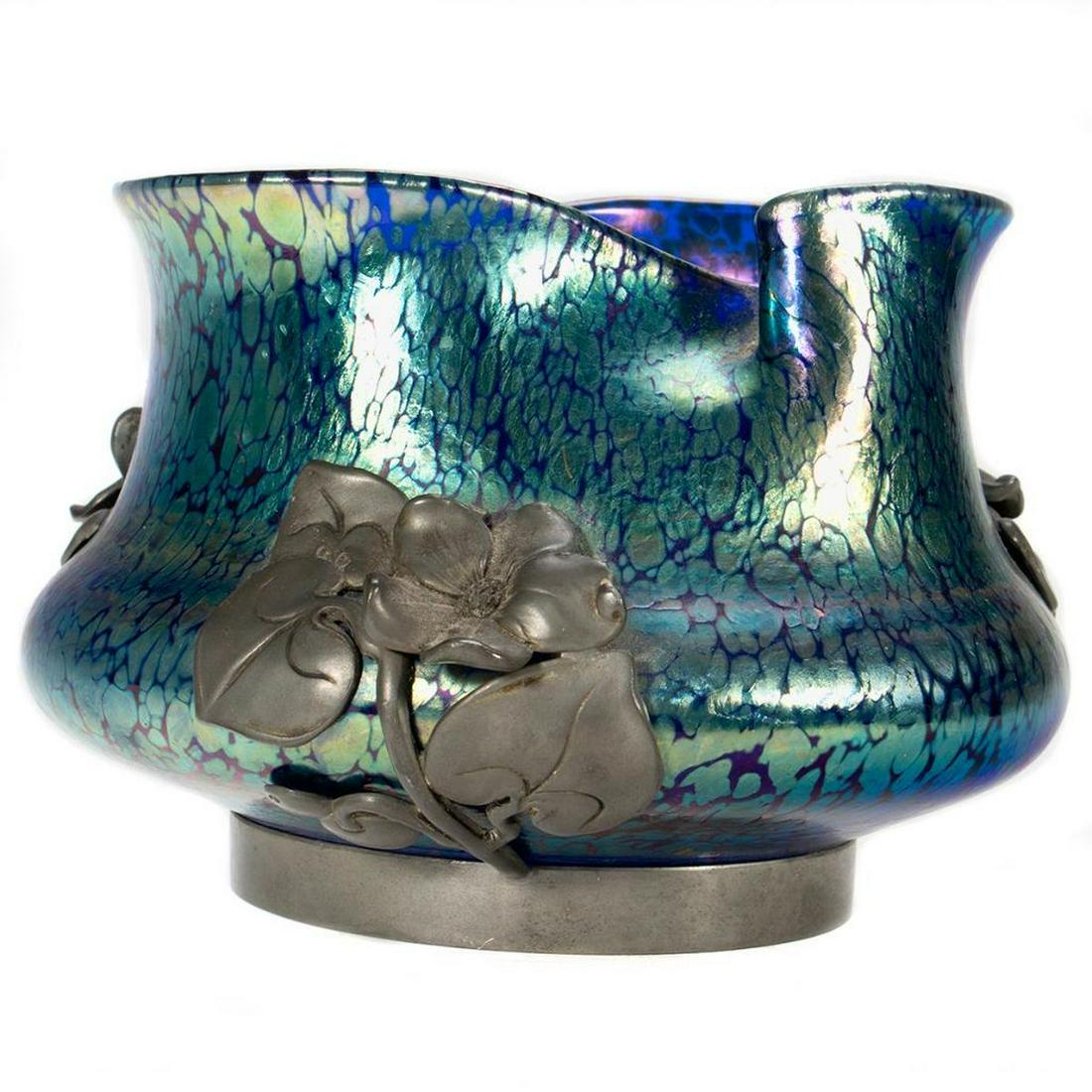Loetz Art Nouveau Glass Vase: The iridescent glass mounted with pewter floral mounts. 4 1/2in (23cm) h. 5 1/2in. (14cm) d. Condition: Very good