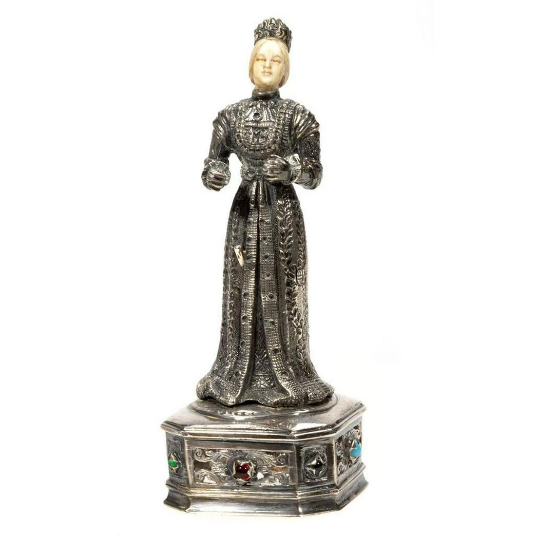 German Medieval-Style Sterling Silver Figure: German Medieval-Style Sterling Silver Figure. Having carved bone heads and standing on a square base with chamfered corners, reticulated designs to the sides, and faux stone cabochons. Marked Sterling