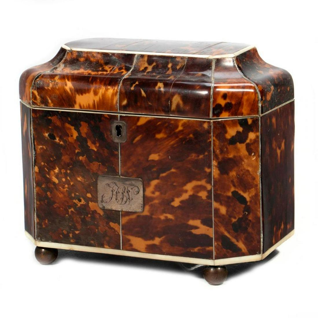 George III Tea Caddy: A late 18th century George III tea caddy. Hinged top with cask design opens to reveal two tea compartments with lids, segmented overall design with dividers and ball feet. Some wear, minor loss. Siz