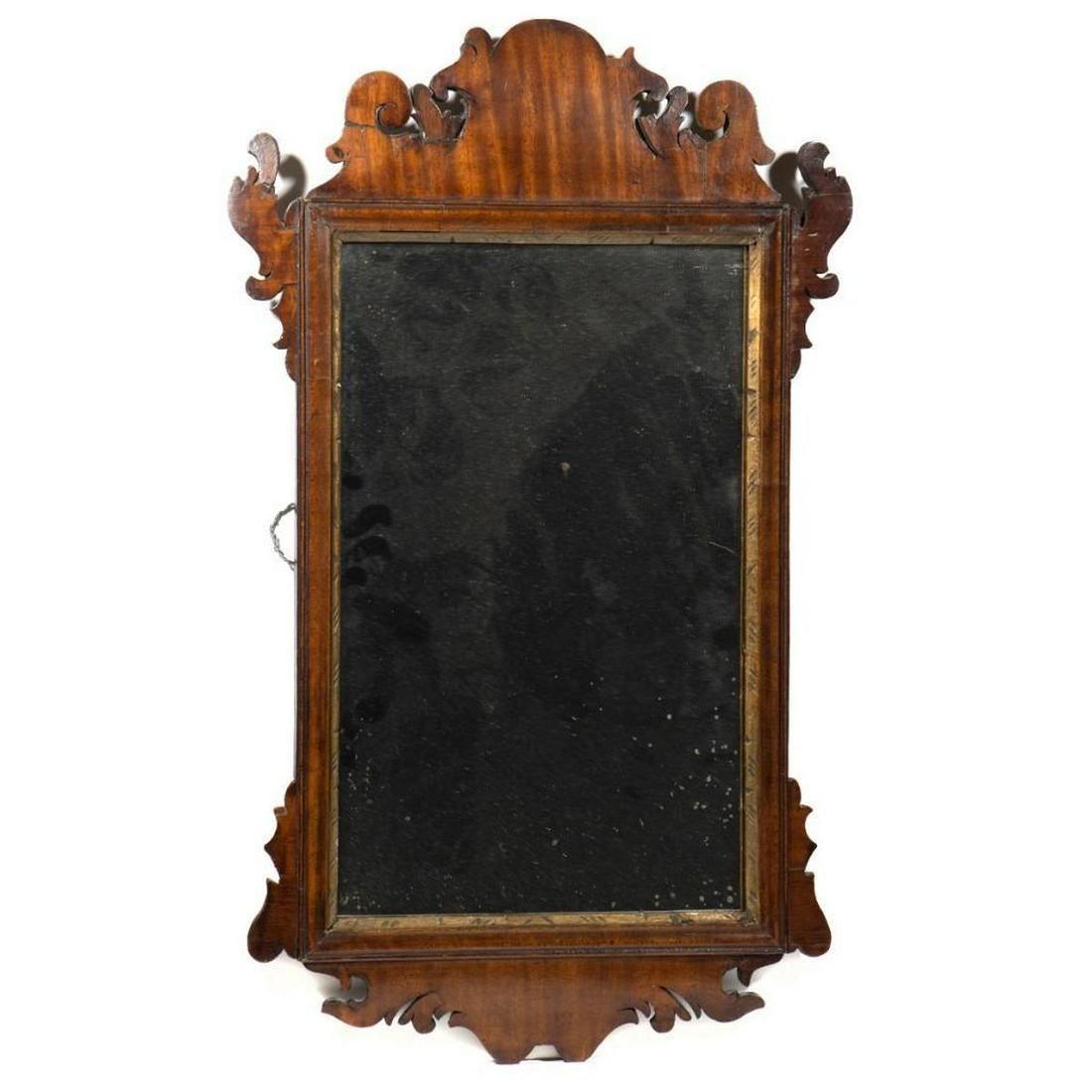 Chippendale Figured Mahogany Mirror: 18th century, with scrolled crest, base, and ears, highly figured mahogany, distressed mirror plate. Size: 26" x 16"
