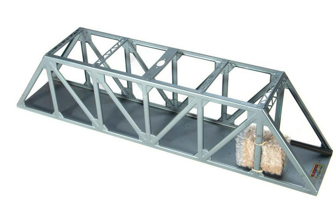 American Flyer by Colber Truss Bridge with vibration: American Flyer by Colber Truss Bridge modified for a Colber vibration motor beacon. Also two mounting holes added in the deck.