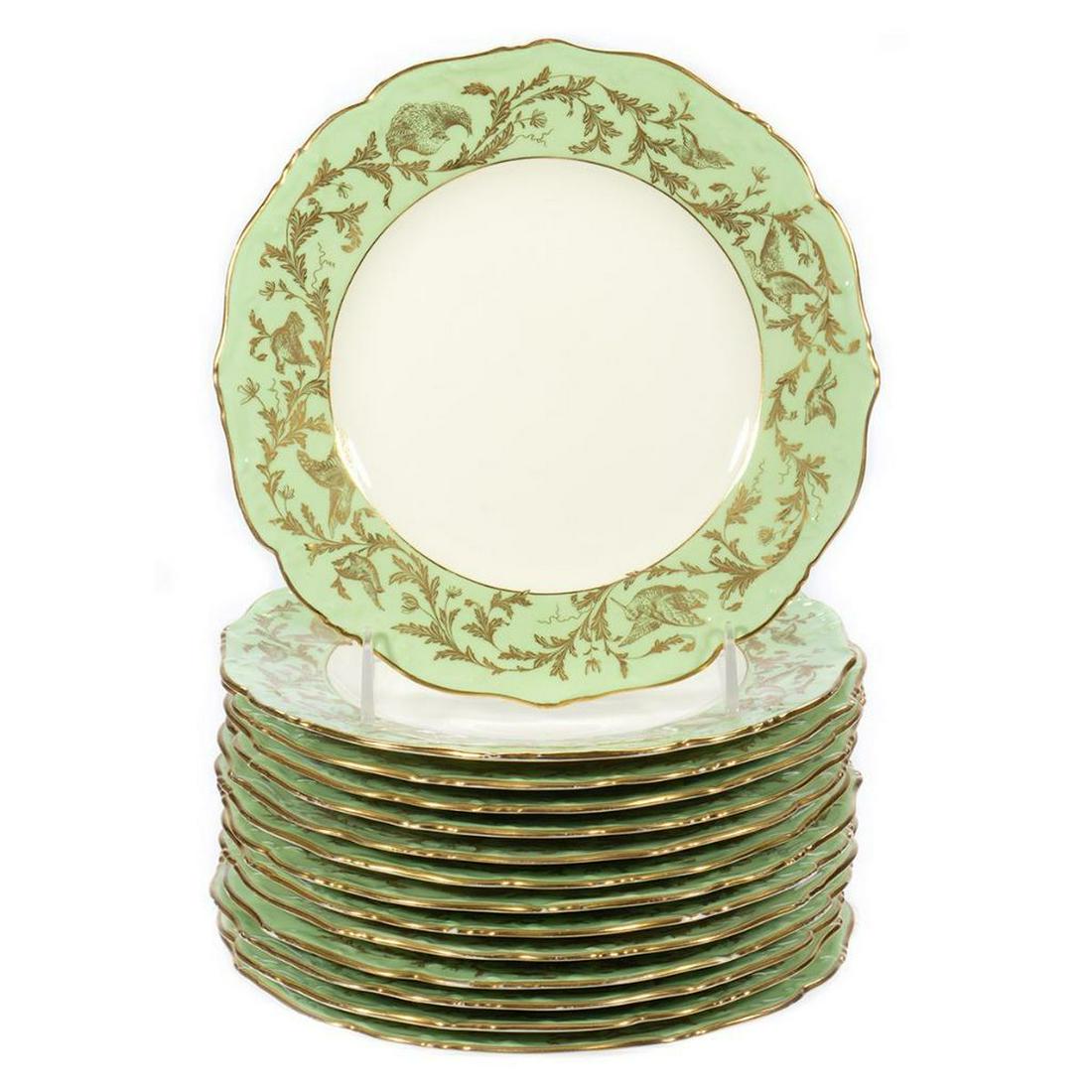 Cauldon Porcelain Plates: Set of fourteen nine inch plates. Trhe rim with gilt floral decorration. Marked Caulldon and C.A. Selzer, Cleveland. Condition: Very slight wear to gilding at edge.