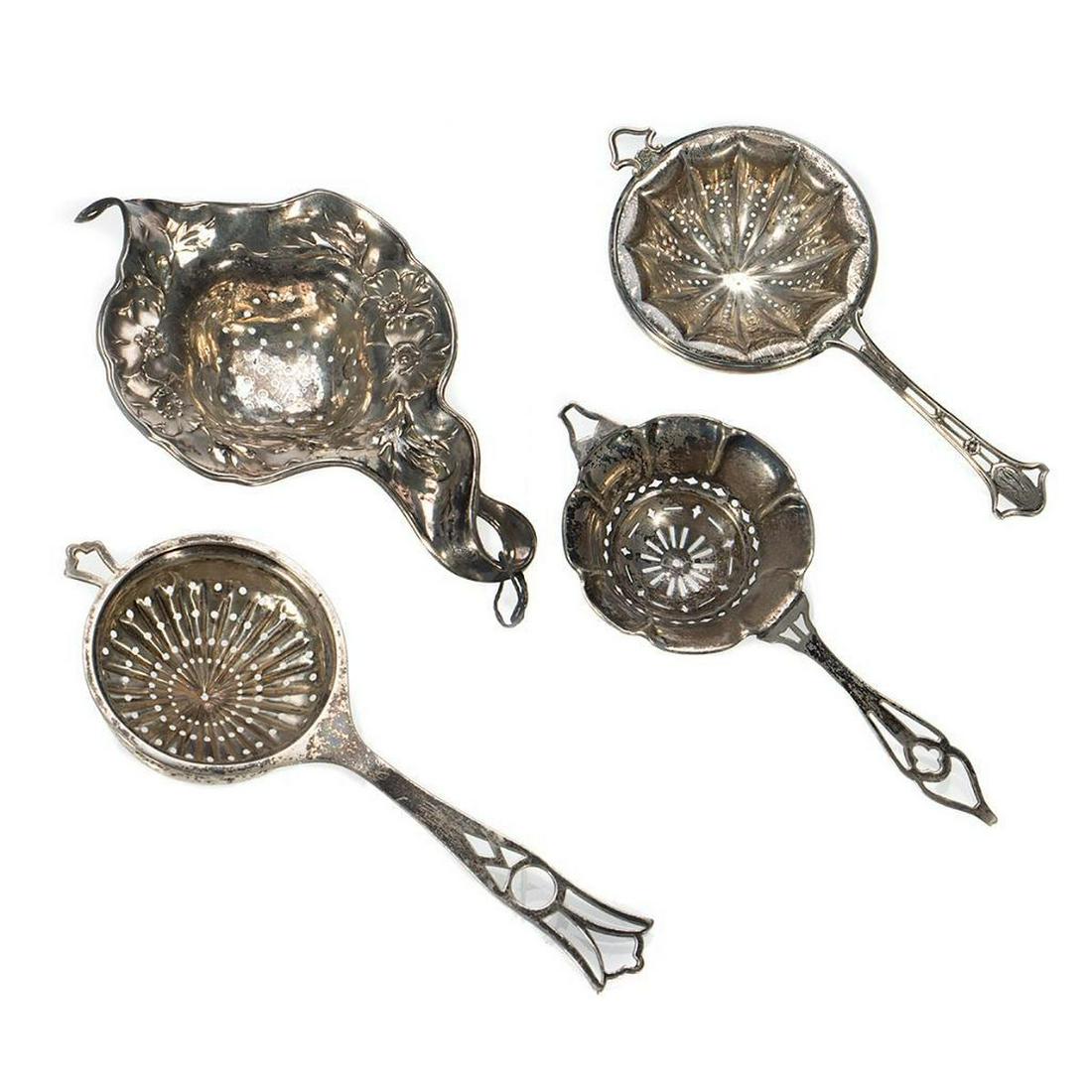 Sterling Tea Strainers: Collection of four. Greatest length 6in. (15cm) 91 grams. Condition: Some tarnish