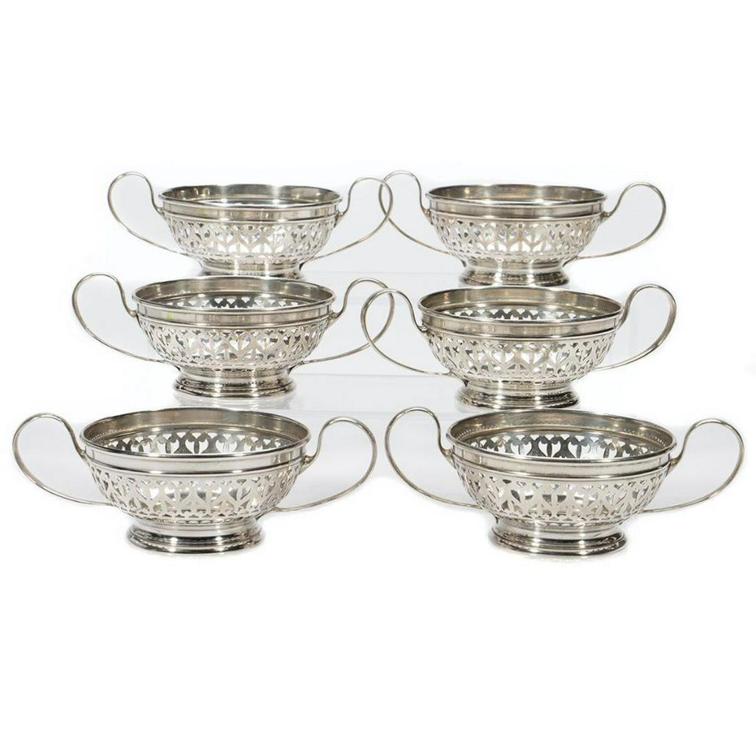Gorham Sterling Coupes: A set of six Neoclassical style pierced decorated. 1 3/4in. h. 5 1/2in. diameter across handles. 357 grams
