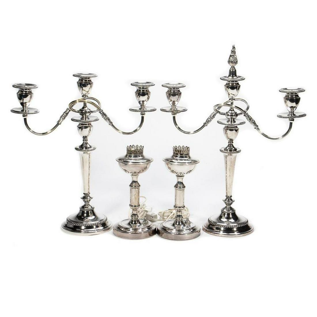 Pair Sheffield Plate Candelabra: In the Neoclassical style with scrolling candlearms on tapering supports.together with a pair of Neoclassical lamp bases. 19in. (48cm) h. Condition: Lacking one flame finial