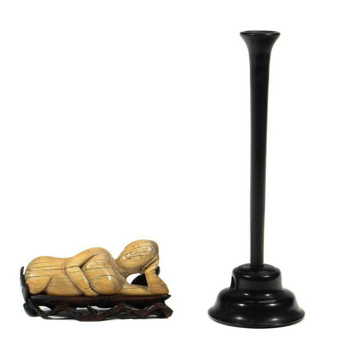 Chinese Doctor's Doll on Stand: The supine figure on a carved fitted base. 3 1/2in l. together with a trumpet form plinth.