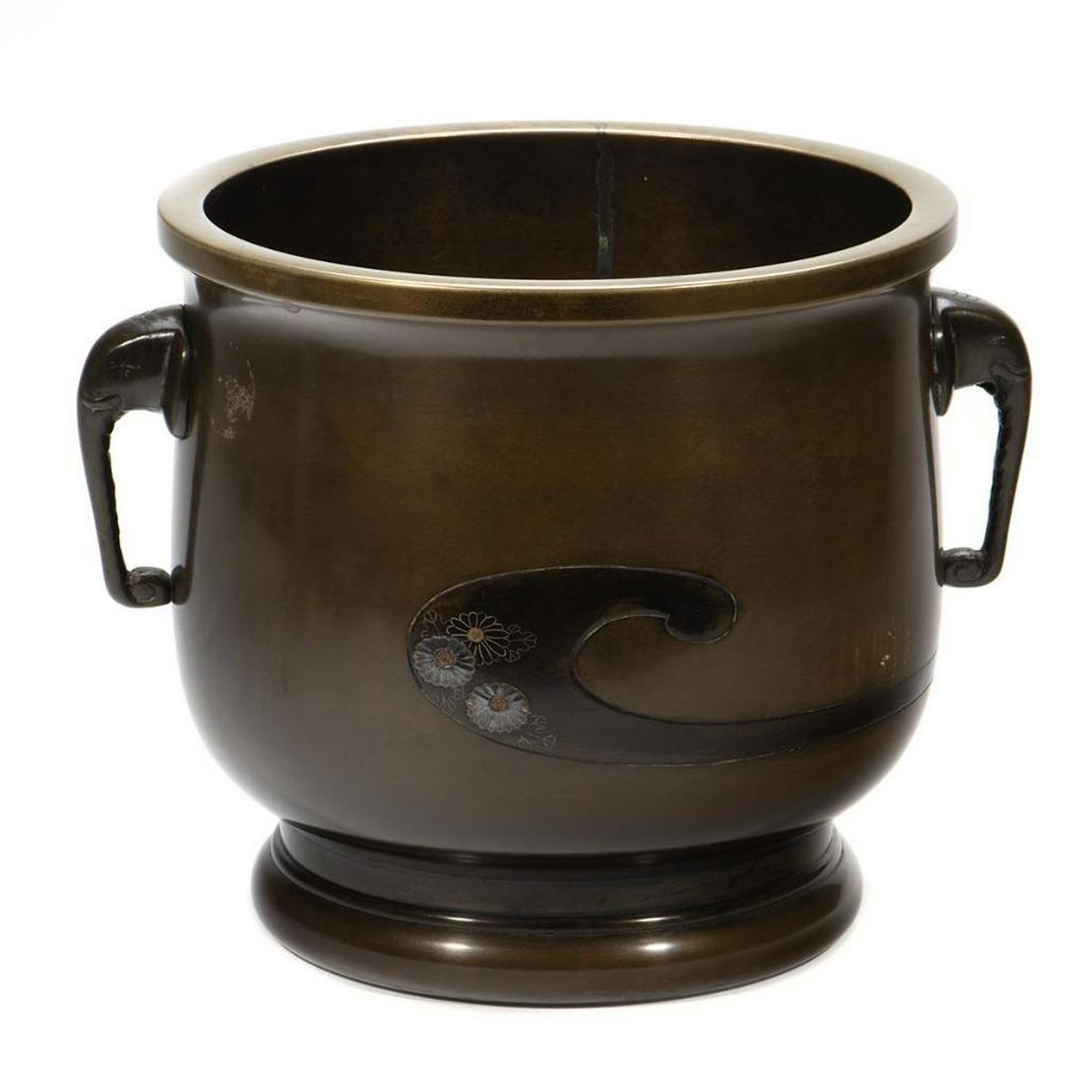 Japanese Bronze Jardiniere: Chrysanthemum inlaid with elephant form handles. 9 1/2in. (24cm) h. 10in. (20cm) d. Condition: Very good