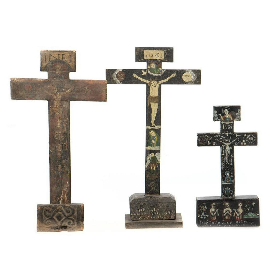 Collection of Memorial Crucifix: Each painted with images of the Passion and memorialized names. Greatest height 21in.