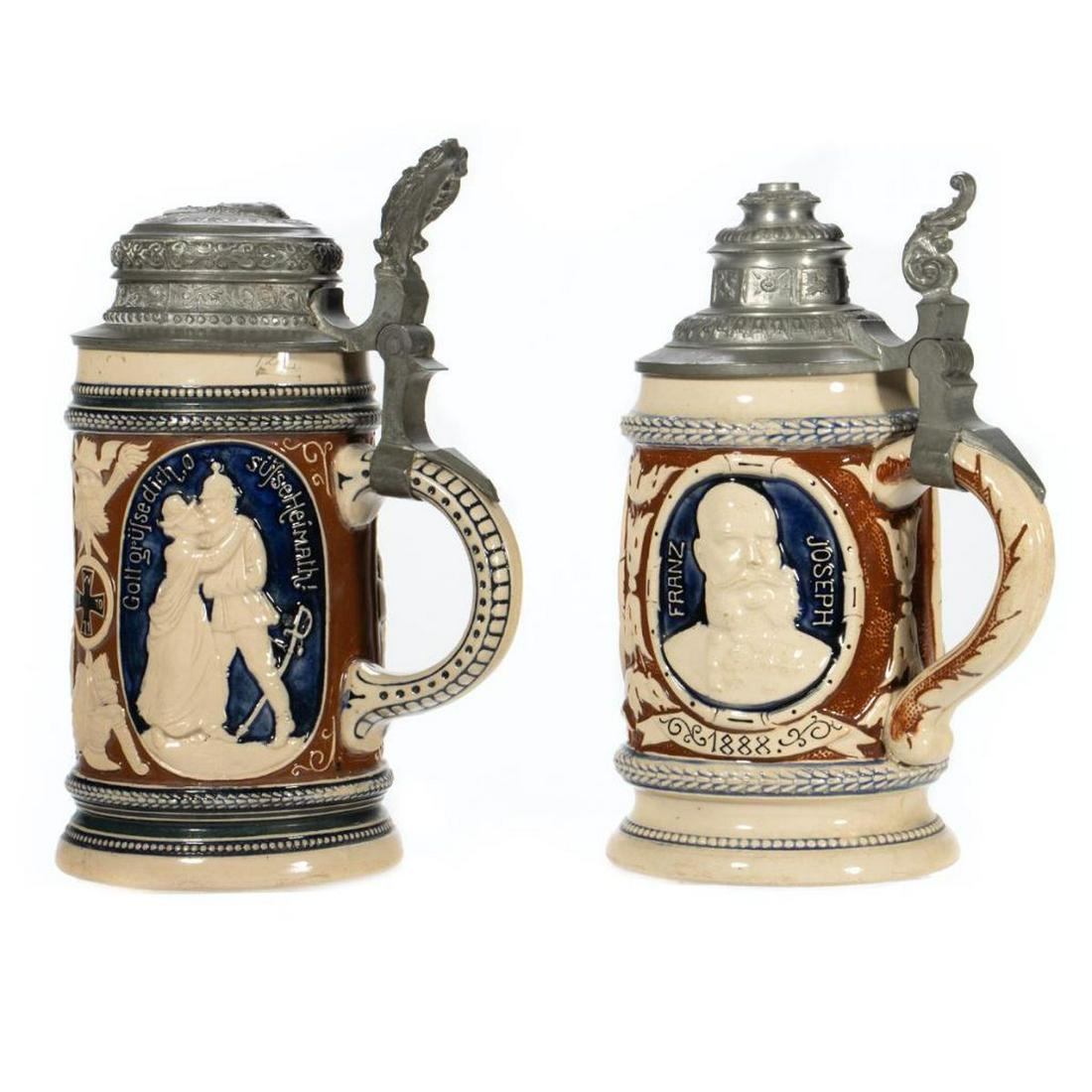 Geschutzt Ceramic and Pewter Steins: One honoring Franz Joseph, the other honoring Kaiser Wilhelm II. Greatest height 8in. Condition: Very good.