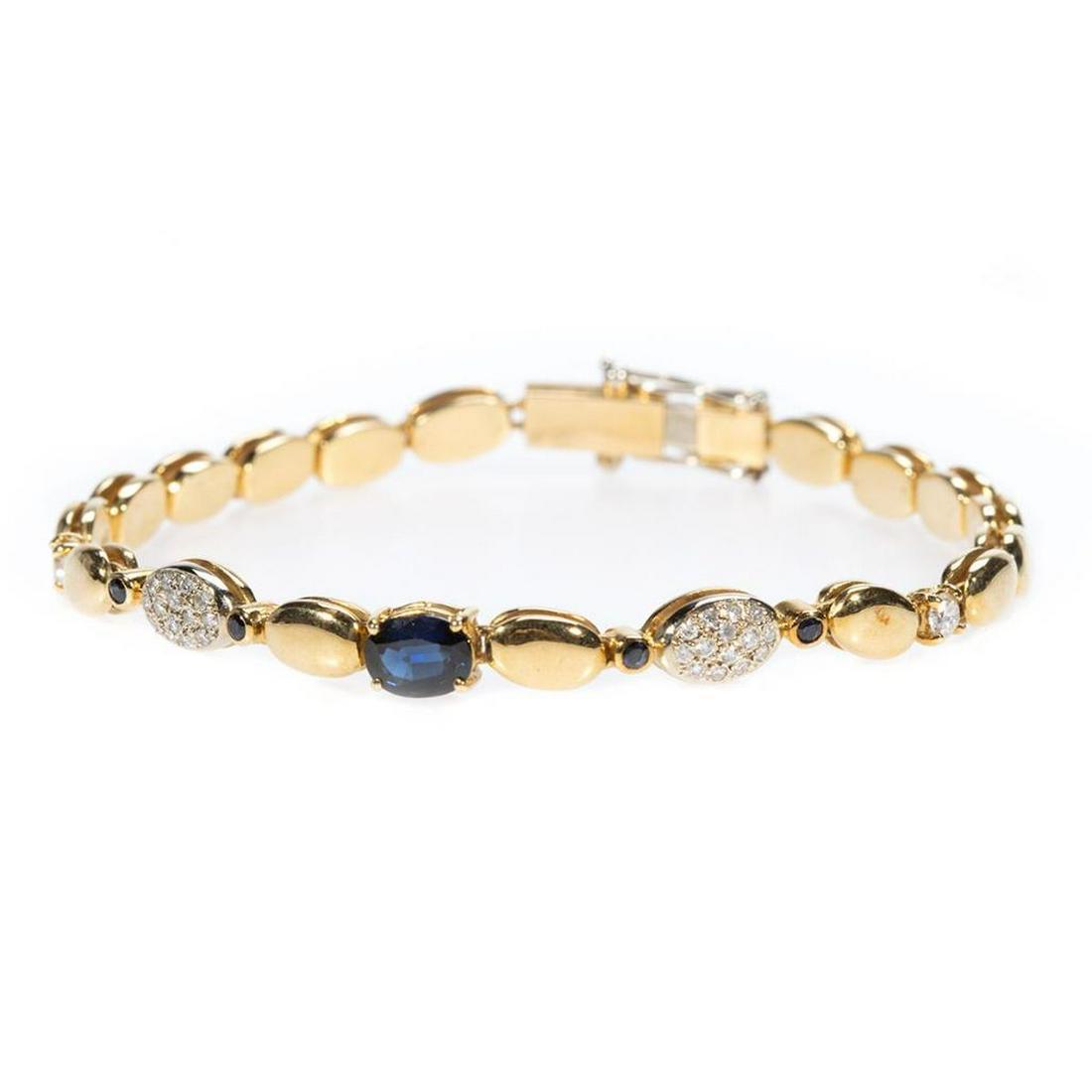 Sapphire, diamond and 18k gold bracelet: designed with one oval-shaped and 4 small round sapphires, accented with 30 round brilliant-cut diamonds, weighing in total approximately 0.35ct. H-I-J/SI-I1; weighing approximately 15.7 grams; length