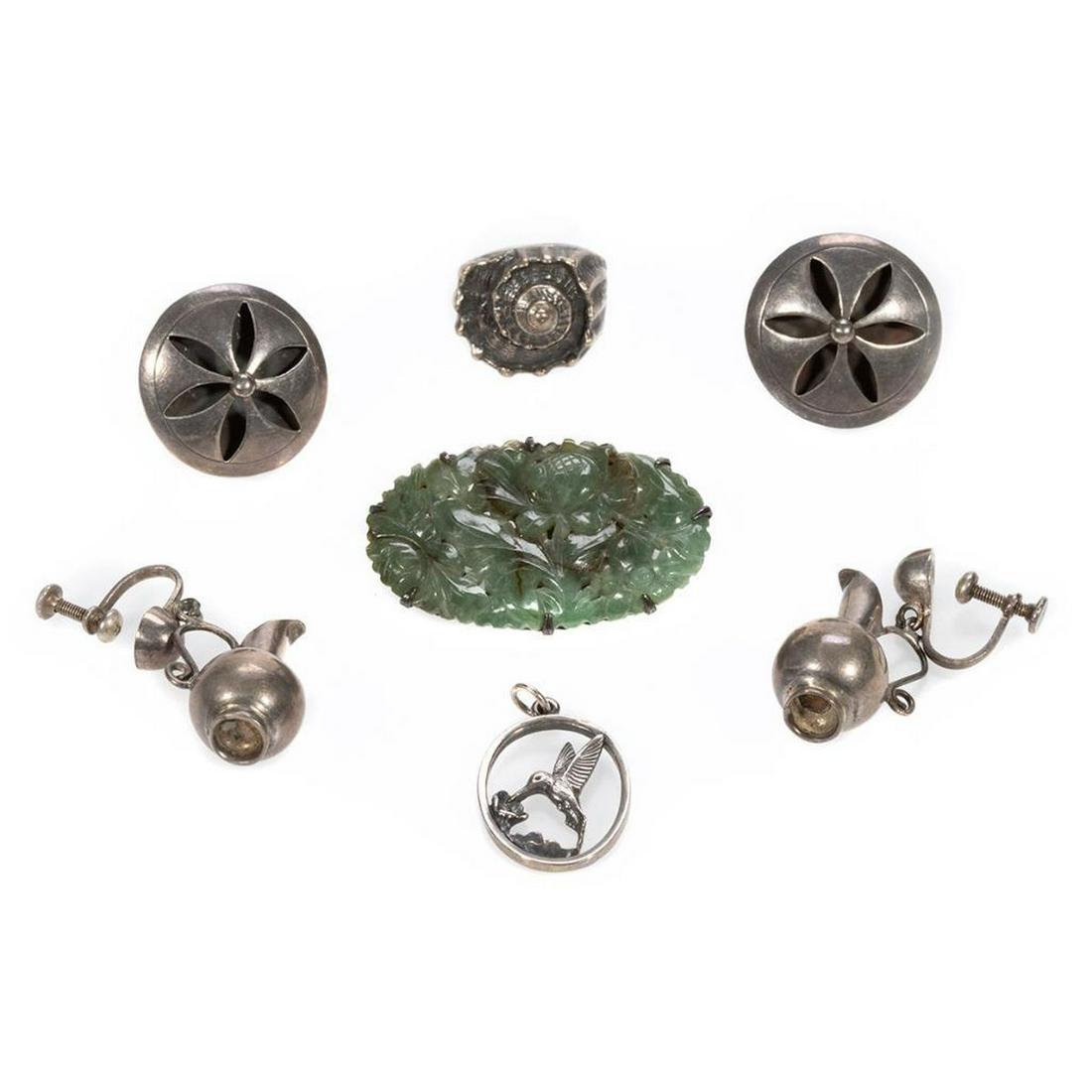 Group of sterling silver jewelry: comprising a pair of urn motif earrings by William Spratling, circa 1940's, a James Avery ring and pendant, a pair of Alpaca PA Taxco earrings, and a carved green hardstone brooch